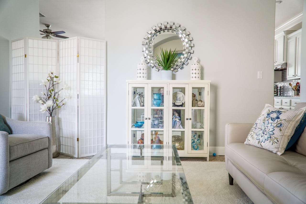 The Art of Drawing Readers In: Your attractive post title goes here Bright living room with modern decor, featuring a glass table, plush sofas, and decorative elements in Austin, TX.